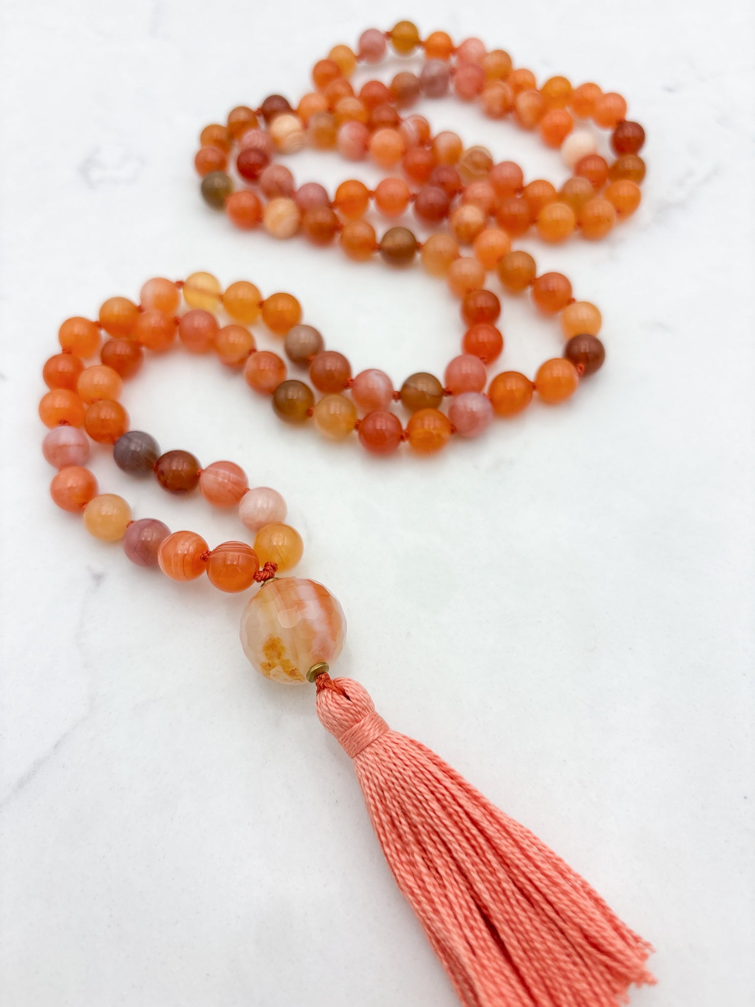 Red Botswana Agate Gemstone Mala with carnelain guru bead and peach tassel | radiant malas | handmade in Boulder, colorado