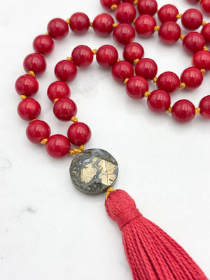 red coral gemstone mala necklace with faceted pyrite guru bead and red tassel | radiant malas | handmade in boulder, colorado