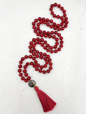 red coral gemstone mala necklace with faceted pyrite guru bead and red tassel | radiant malas | handmade in boulder, colorado