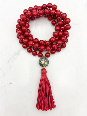 red coral gemstone mala necklace with faceted pyrite guru bead and red tassel | radiant malas | handmade in boulder, colorado
