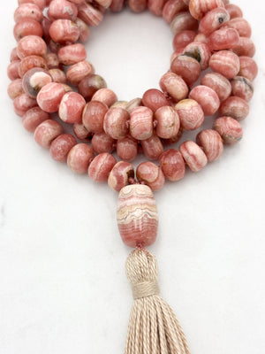 rhodochrosite gemstone mala with rhodochrosite guru bead and tan tassel | radiant malas | handmade in boulder, colorado