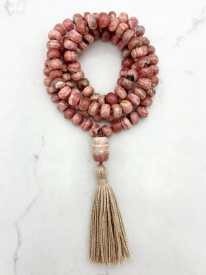 rhodochrosite gemstone mala with rhodochrosite guru bead and tan tassel | radiant malas | handmade in boulder, colorado