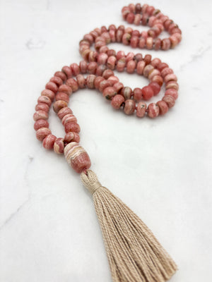 rhodochrosite gemstone mala with rhodochrosite guru bead and tan tassel | radiant malas | handmade in boulder, colorado