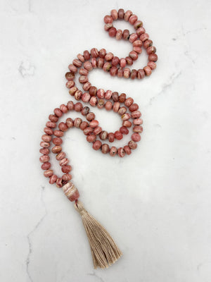 rhodochrosite gemstone mala with rhodochrosite guru bead and tan tassel | radiant malas | handmade in boulder, colorado