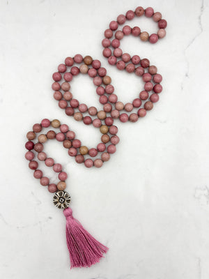 rhodonite gemstone mala with flower carved bone guru bead and pink tassel | radiant malas | handmade in boulder, colorado