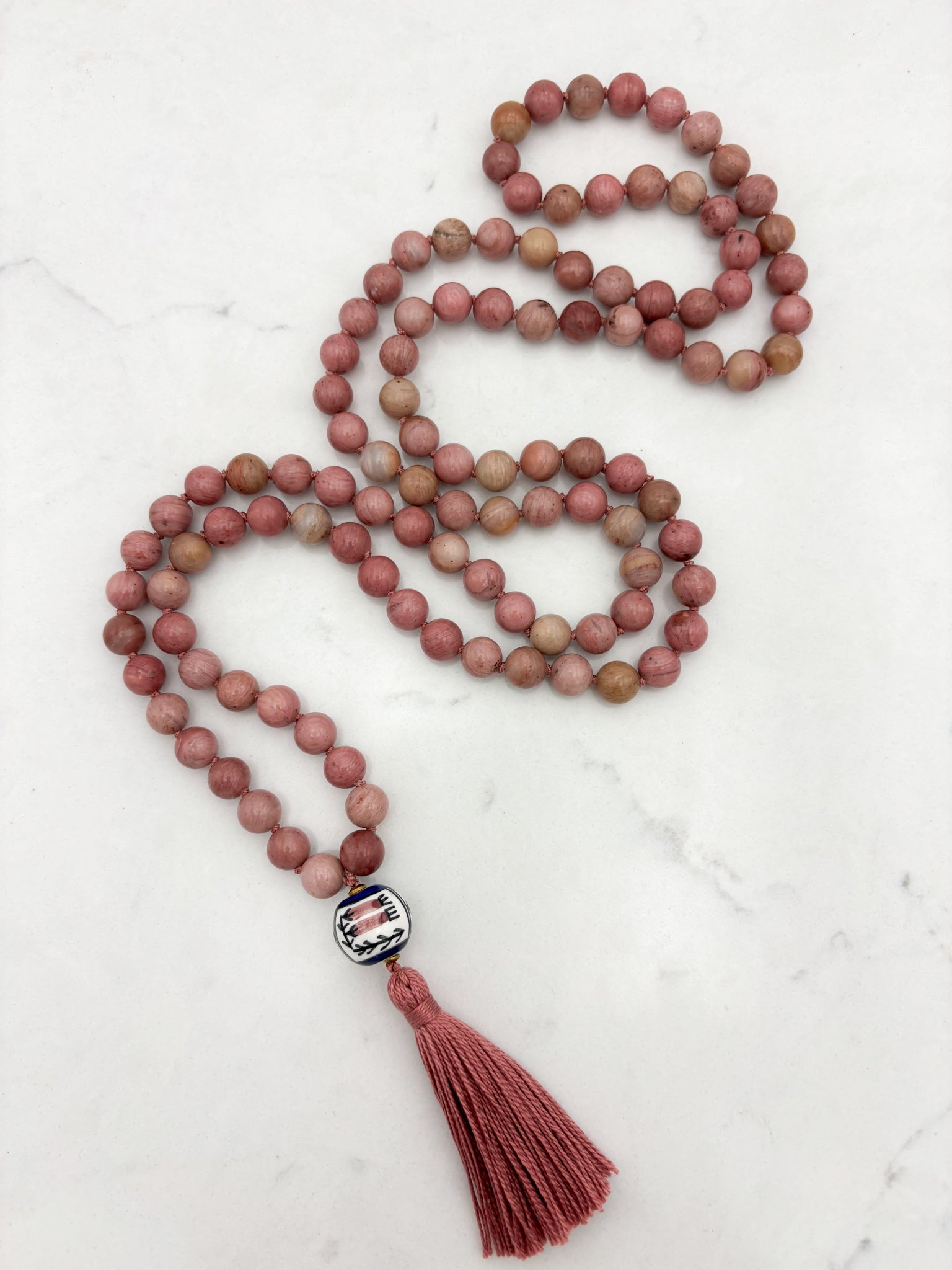 rhodonite gemstone mala with painted ceramic guru bead and pink tassel | radiant malas | handmade in boulder, colorado
