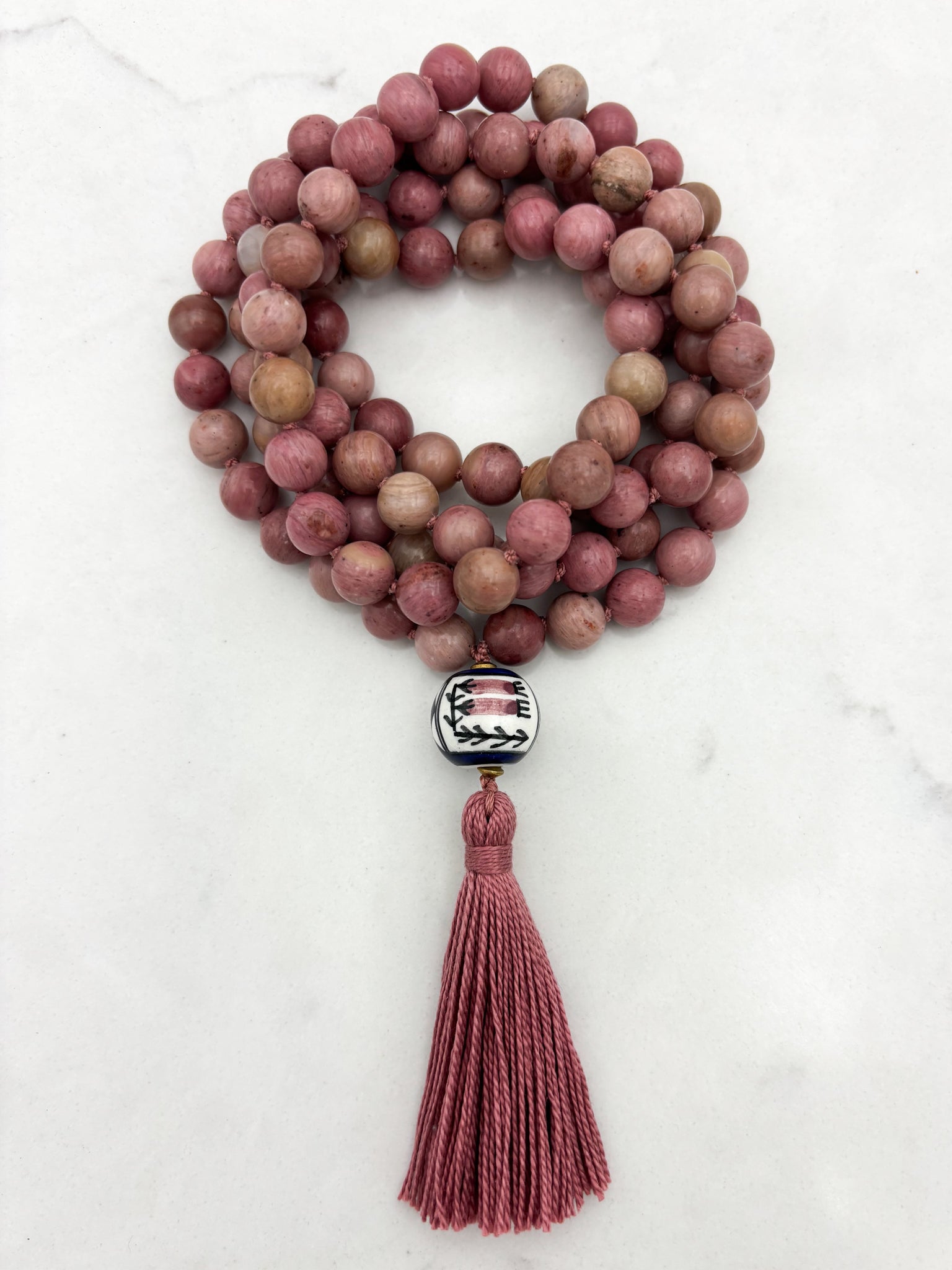 rhodonite gemstone mala with painted ceramic guru bead and pink tassel | radiant malas | handmade in boulder, colorado