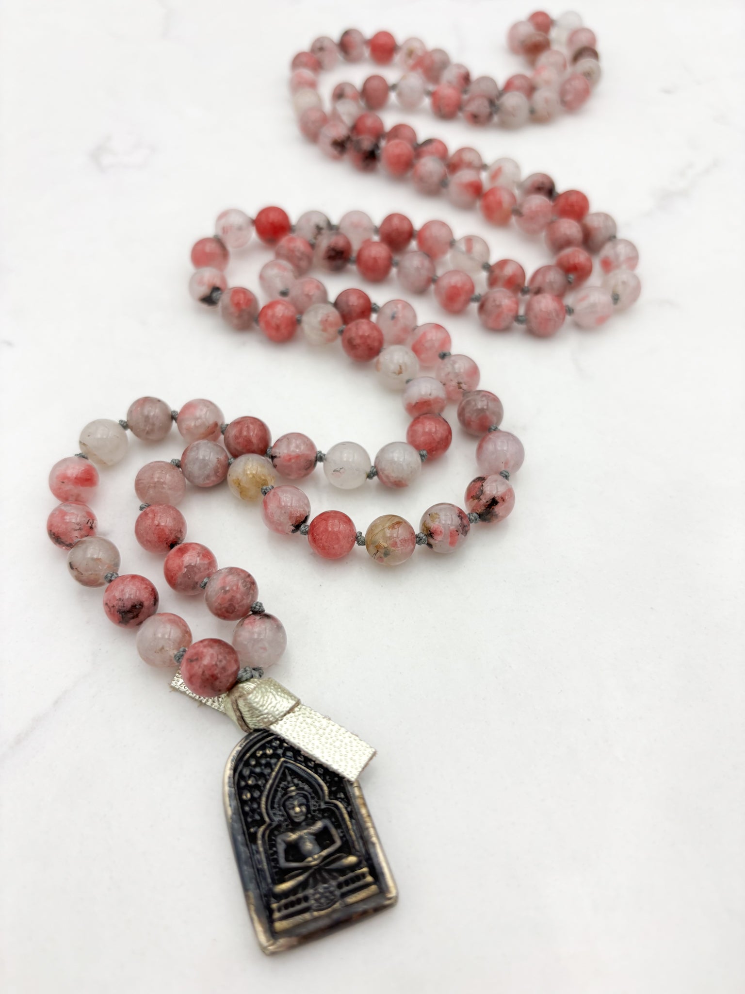 rhodonite in quartz gemstone mala with brass buddha pendant | radiant malas | handmade in boulder, colorado
