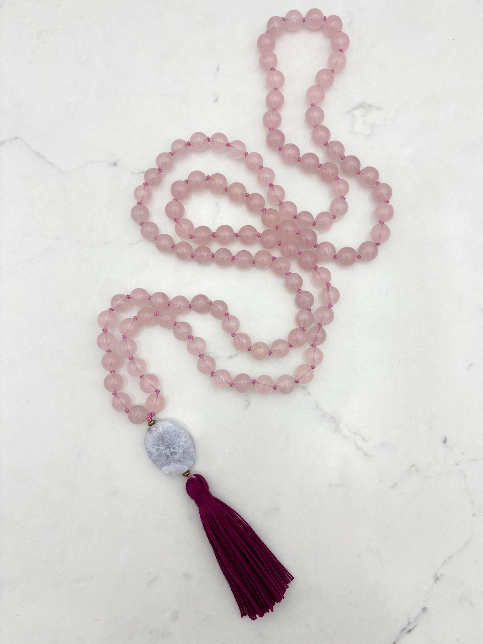 rose quartz gemstone mala necklace with blue lace agate guru bead and dark pink tassel | radiant malas | handmade in boulder, colorado