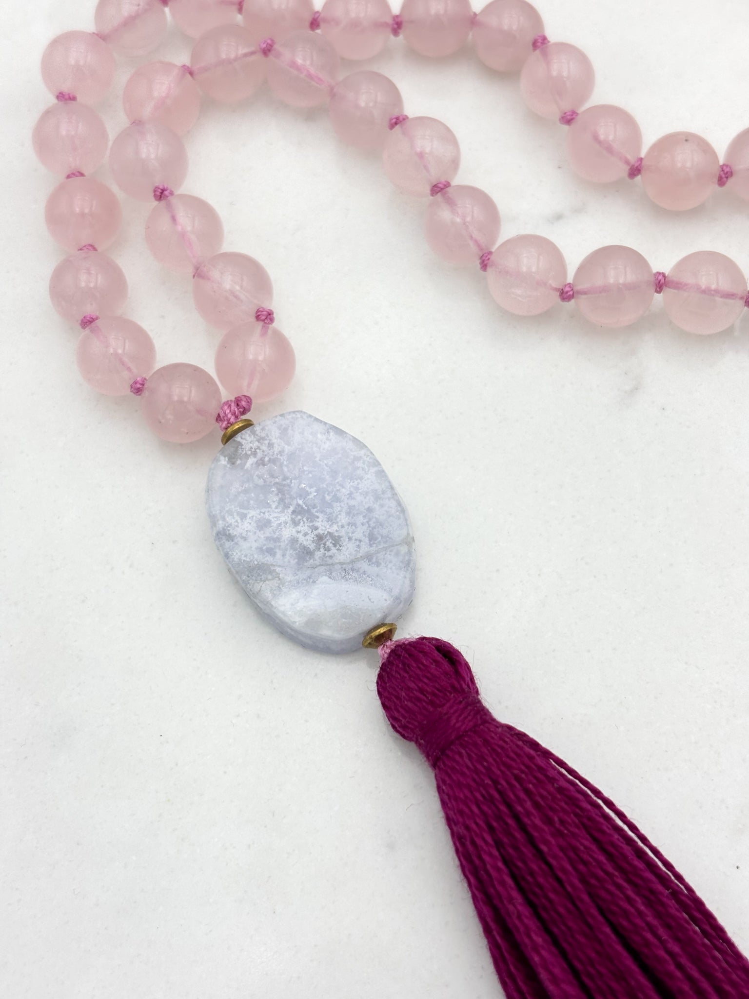 rose quartz gemstone mala necklace with blue lace agate guru bead and dark pink tassel | radiant malas | handmade in boulder, colorado