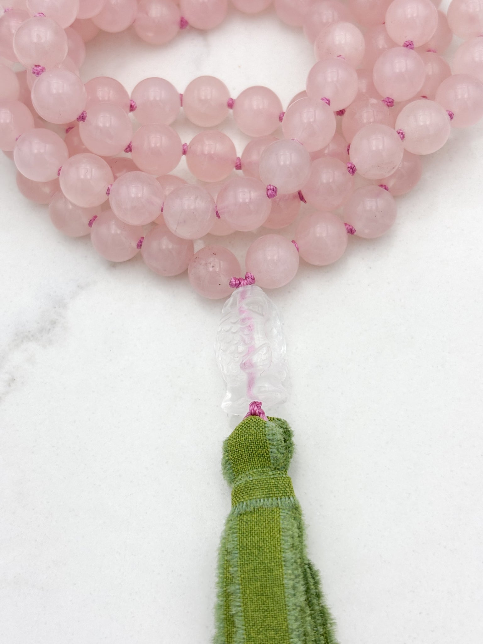 rose quartz gemstone mala with clear quartz carved koi guru bead and green silk ribbon tasssel | radiant malas | handmade in boulder, colorado