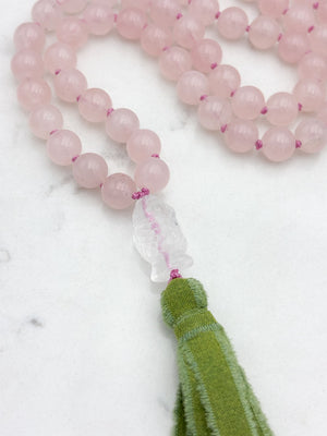 rose quartz gemstone mala with clear quartz carved koi guru bead and green silk ribbon tasssel | radiant malas | handmade in boulder, colorado