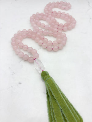 rose quartz gemstone mala with clear quartz carved koi guru bead and green silk ribbon tasssel | radiant malas | handmade in boulder, colorado