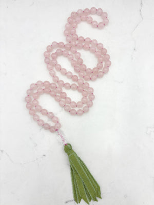 rose quartz gemstone mala with clear quartz carved koi guru bead and green silk ribbon tasssel | radiant malas | handmade in boulder, colorado
