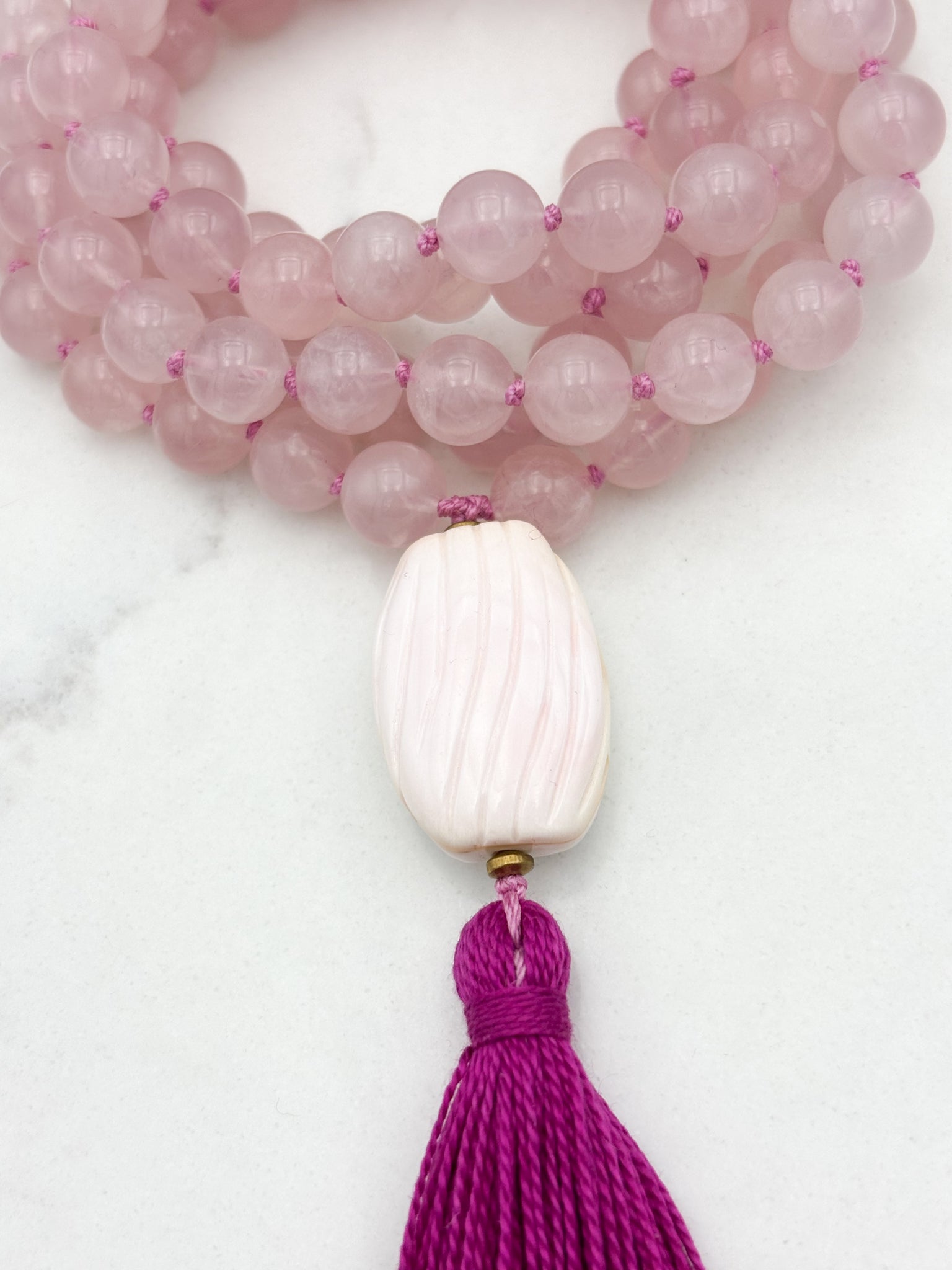 rose quartz gemstone mala with shell guru bead and pink tassel | radiant malas | handmade in boulder, colorado