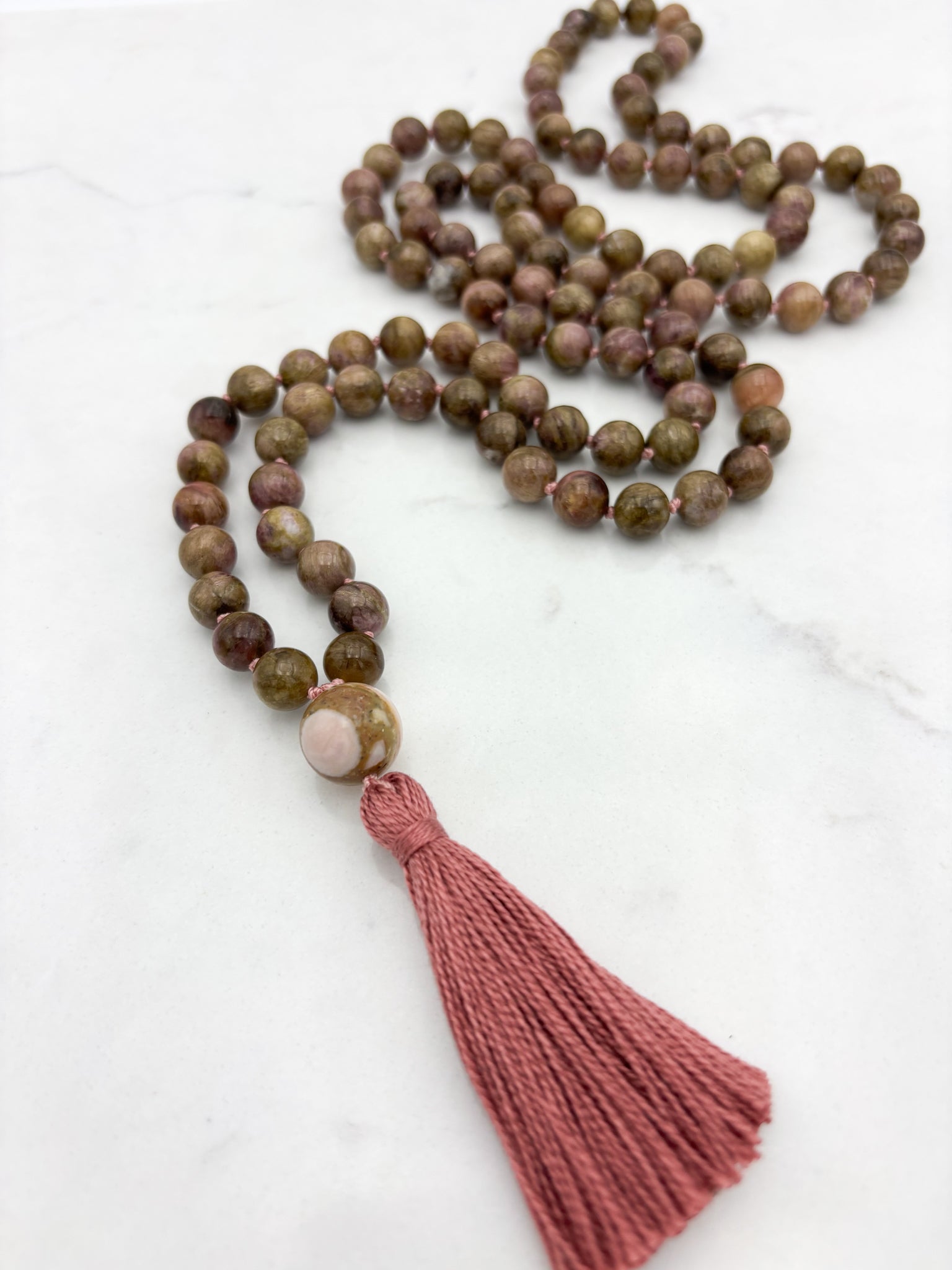 rosebud cat's eye tourmaline gemstone mala necklace with rhodochrosite guru bead and rose colored tassel | radiant malas | handmade in boulder, colorado