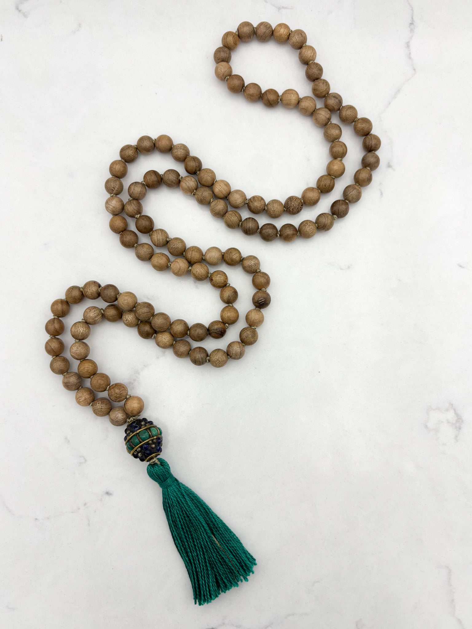 Sandalwood mala meditation necklace with tibetan guru bead w/ turquoise and lapis, and a green tassel | radiant malas | handmade in boulder, colorado