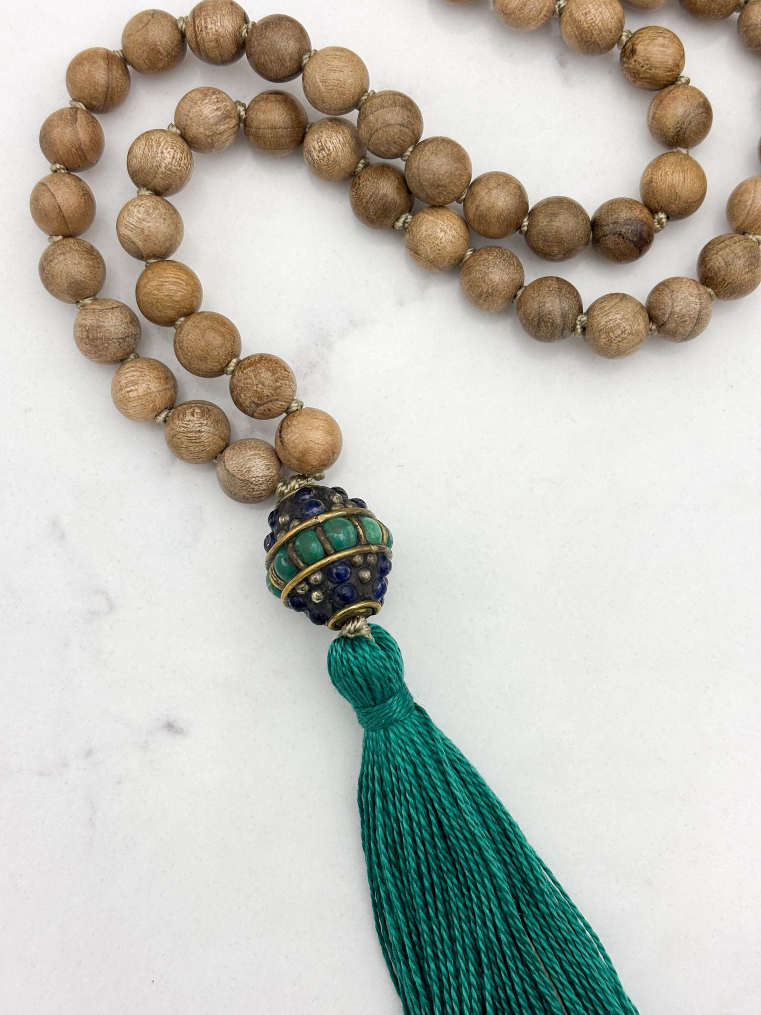 Sandalwood mala meditation necklace with tibetan guru bead w/ turquoise and lapis, and a green tassel | radiant malas | handmade in boulder, colorado