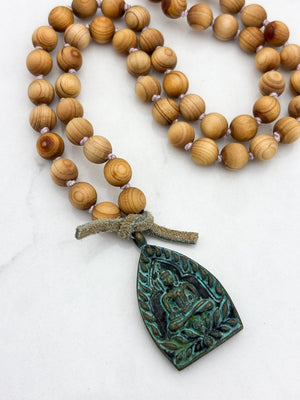 sandalwood mala with brass buddha pendant | radiant malas | handmade in boulder, colorado