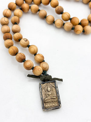 sandalwood mala with brass buddha pendant | radiant malas | handmade in boulder, colorado