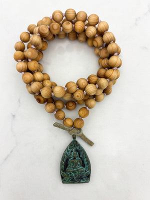 sandalwood mala with brass buddha pendant | radiant malas | handmade in boulder, colorado