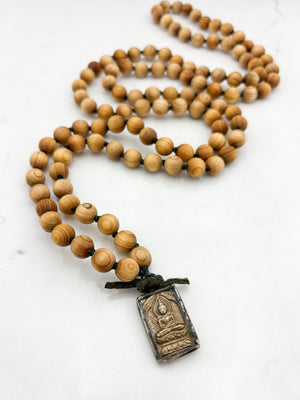 sandalwood mala with brass buddha pendant | radiant malas | handmade in boulder, colorado