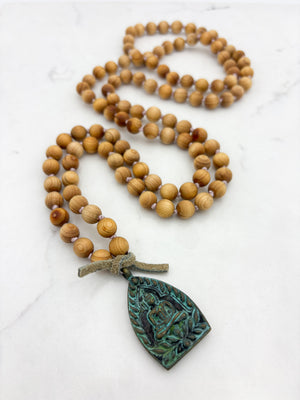 sandalwood mala with brass buddha pendant | radiant malas | handmade in boulder, colorado