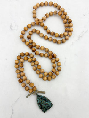 sandalwood mala with brass buddha pendant | radiant malas | handmade in boulder, colorado