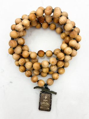 sandalwood mala with brass buddha pendant | radiant malas | handmade in boulder, colorado