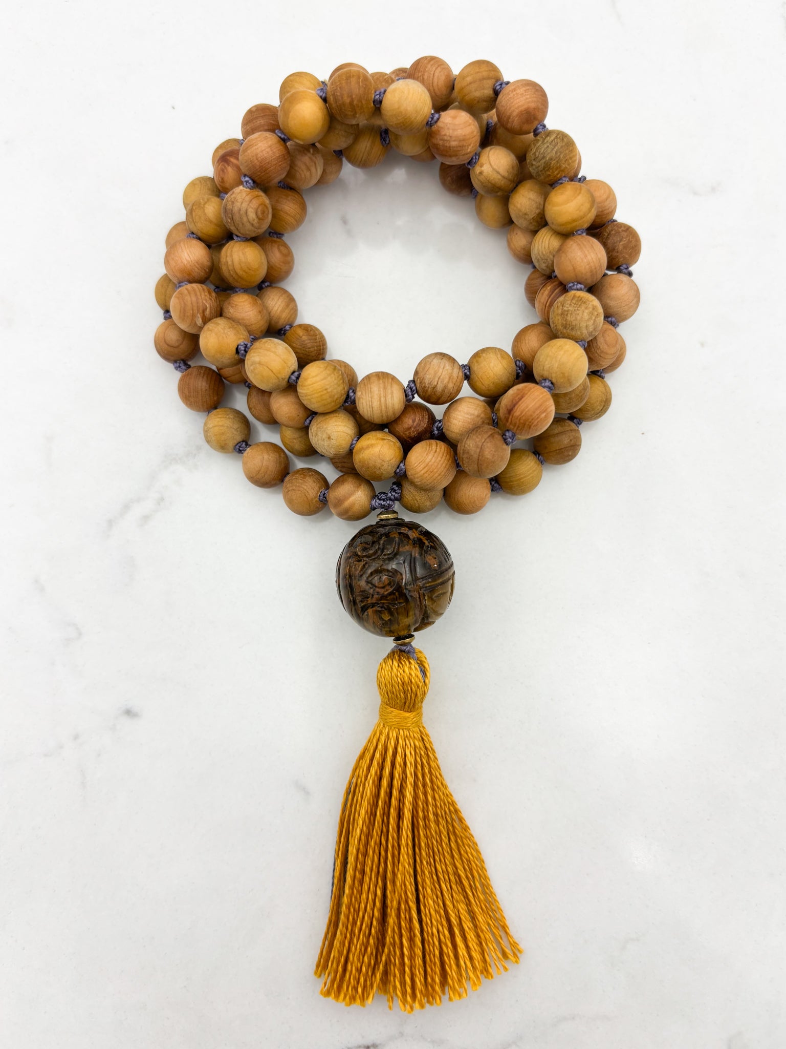 Sandalwood mala meditation necklace with tiger's eye  guru bead, and a yellow tassel | radiant malas | handmade in boulder, colorado