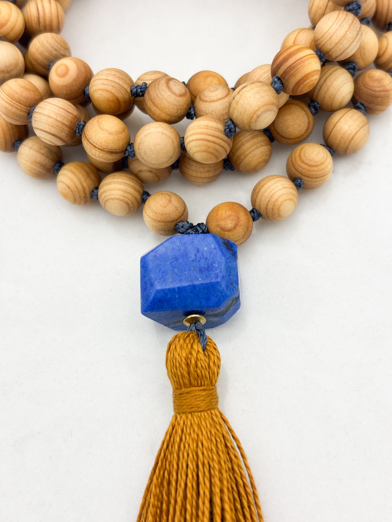 sandalwood mala with lapis guru bead and gold tassel | radiant malas | handmade in boulder, colorado