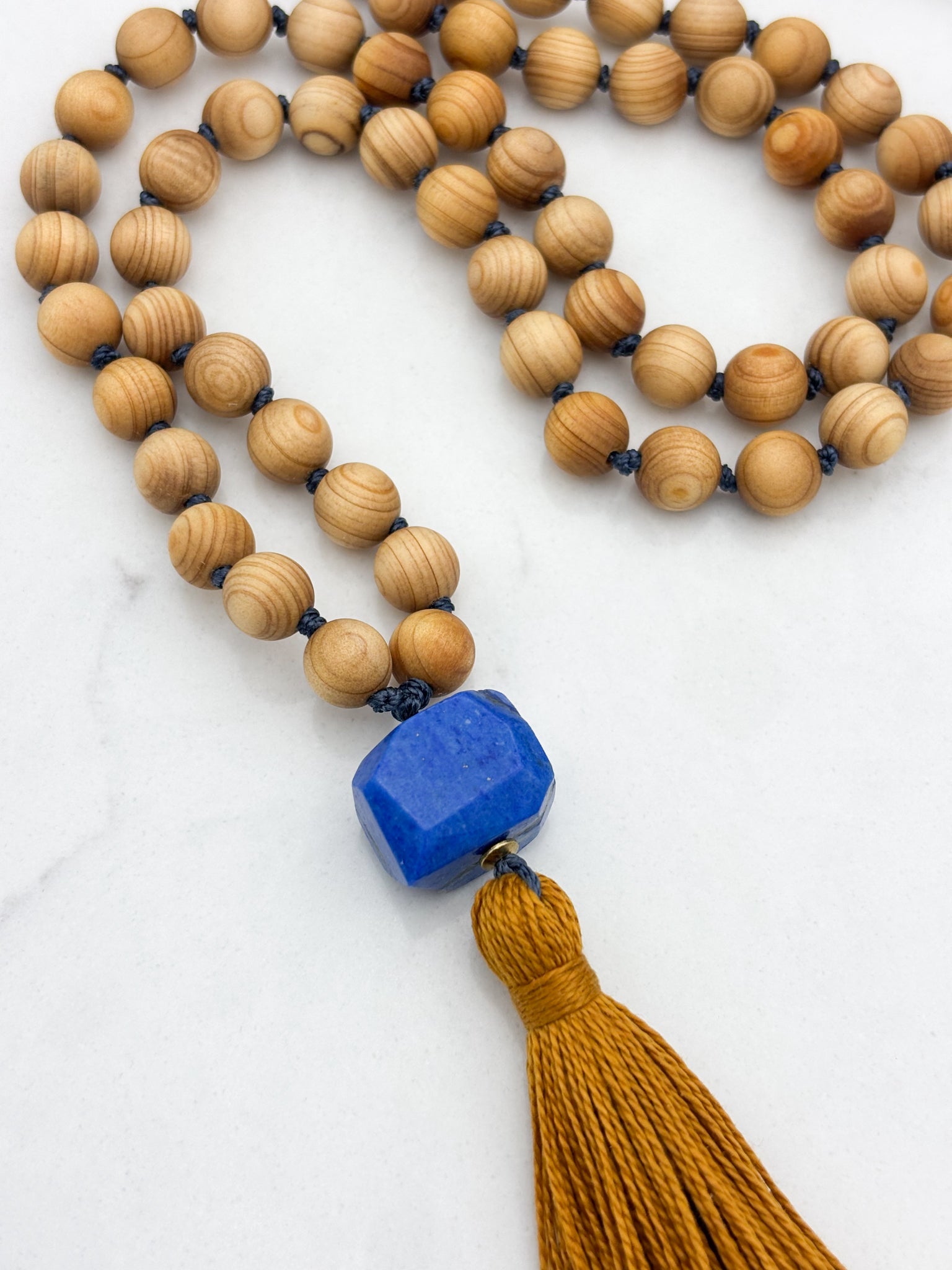 sandalwood mala with lapis guru bead and gold tassel | radiant malas | handmade in boulder, colorado