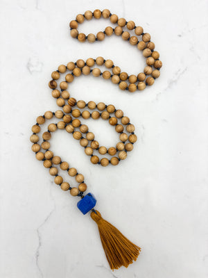 sandalwood mala with lapis guru bead and gold tassel | radiant malas | handmade in boulder, colorado