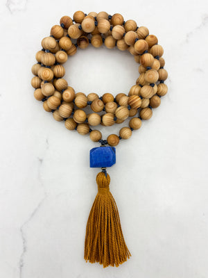 sandalwood mala with lapis guru bead and gold tassel | radiant malas | handmade in boulder, colorado