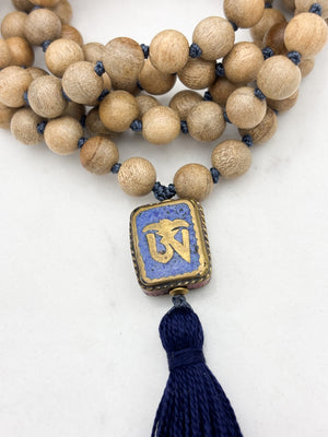 sandalwood mala with brass, lapis and coral guru bead and navy tassel | radiant malas | handmade in boulder, colorado