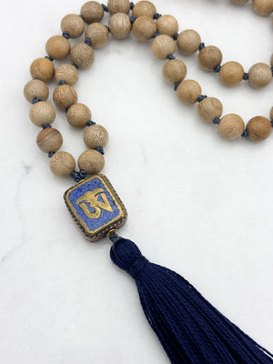 sandalwood mala with brass, lapis and coral guru bead and navy tassel | radiant malas | handmade in boulder, colorado