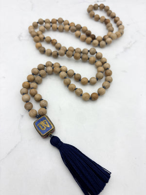sandalwood mala with brass, lapis and coral guru bead and navy tassel | radiant malas | handmade in boulder, colorado