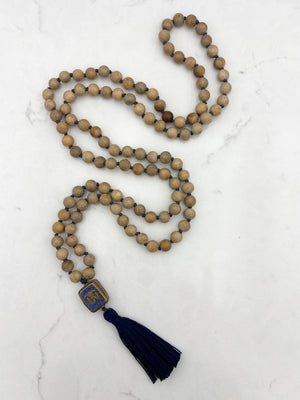 sandalwood mala with brass, lapis and coral guru bead and navy tassel | radiant malas | handmade in boulder, colorado