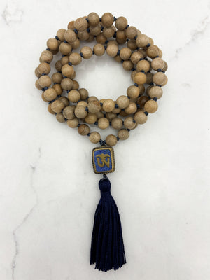 sandalwood mala with brass, lapis and coral guru bead and navy tassel | radiant malas | handmade in boulder, colorado