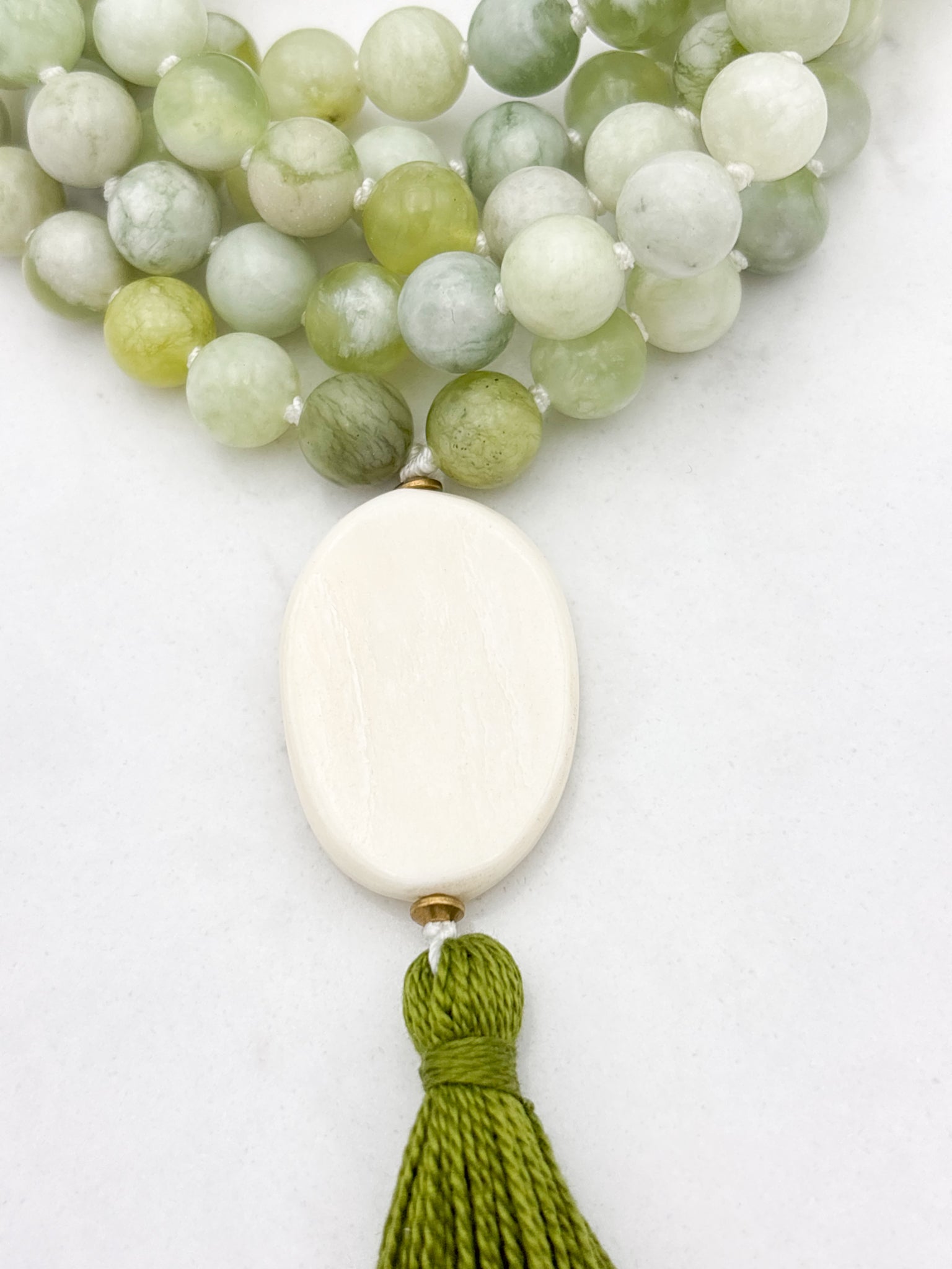 serpentine jade gemstone mala with bone guru bead and green tassel | radiant malas | handmade in boulder, colorado