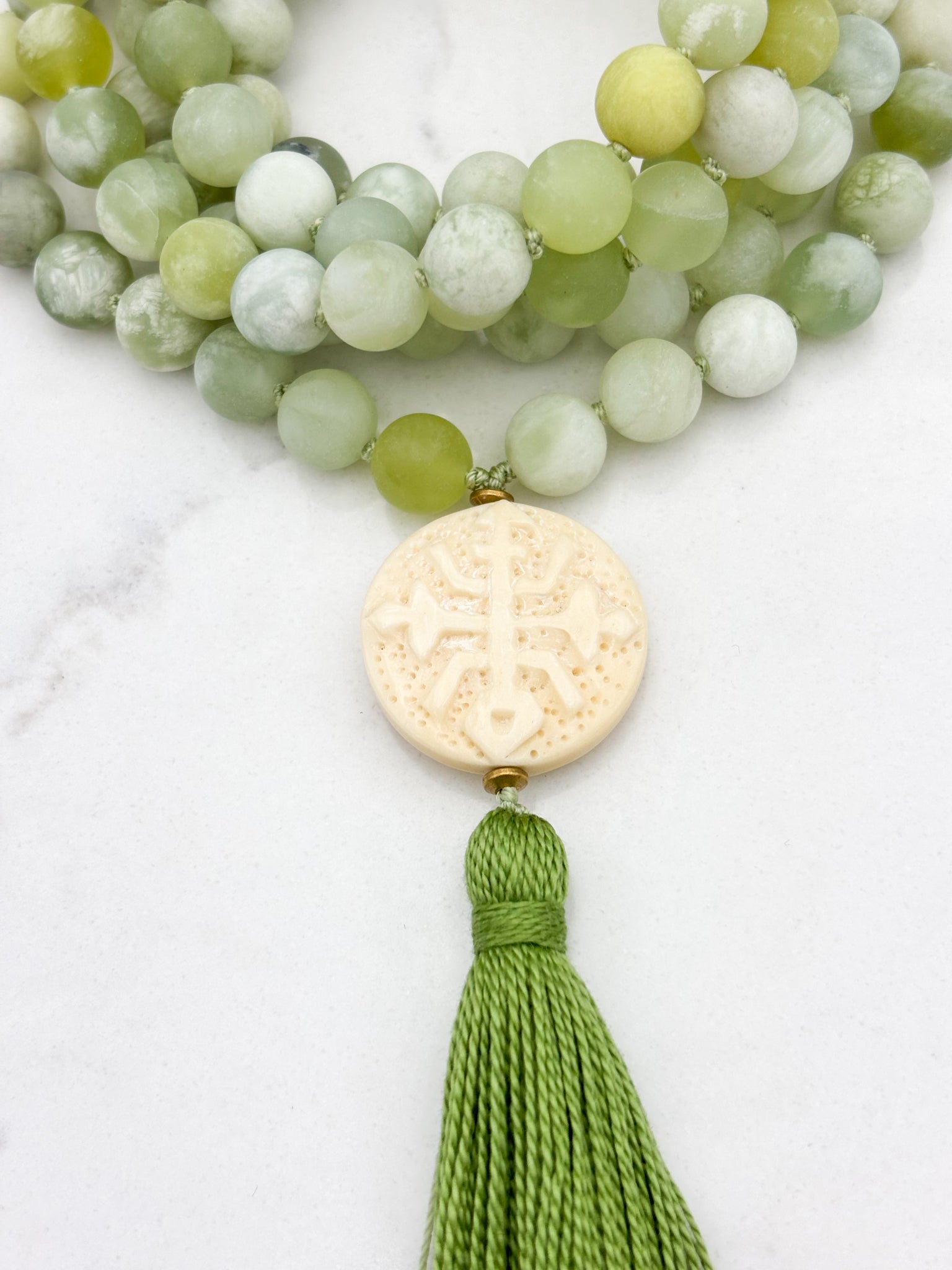 serpentine jade gemstone mala with carved bone guru bead and green tassel | radiant malas | handmade in boulder, colorado