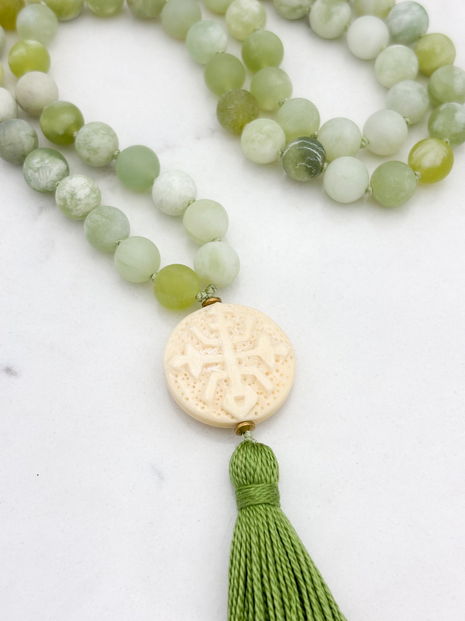 serpentine jade gemstone mala with carved bone guru bead and green tassel | radiant malas | handmade in boulder, colorado