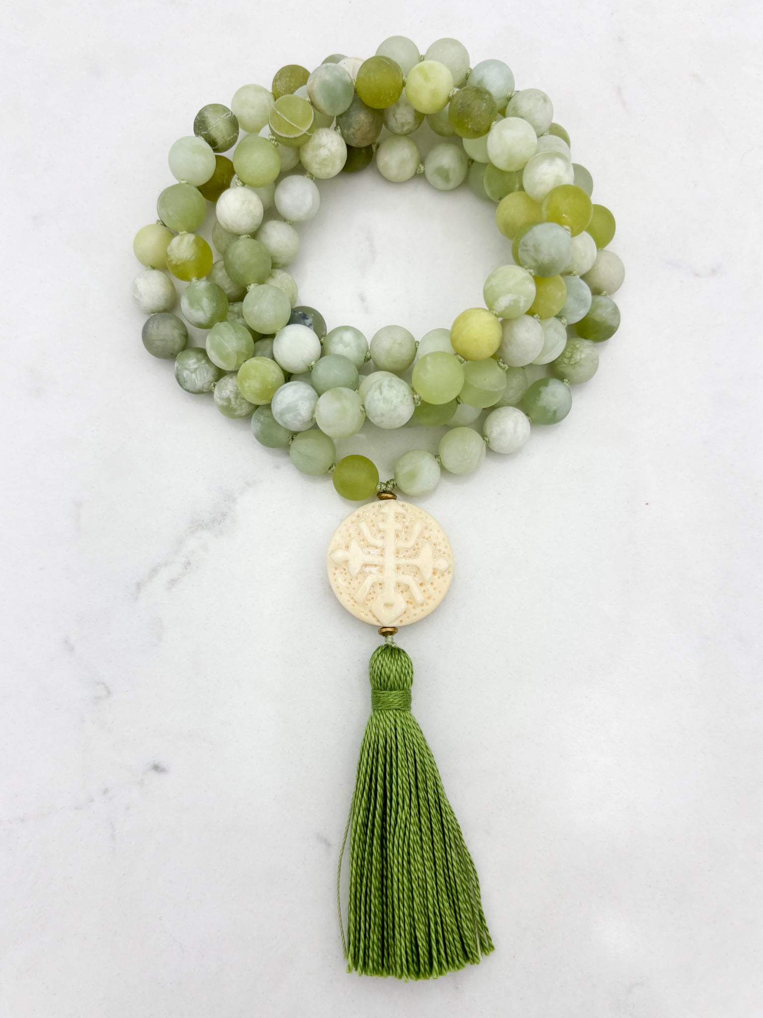serpentine jade gemstone mala with carved bone guru bead and green tassel | radiant malas | handmade in boulder, colorado