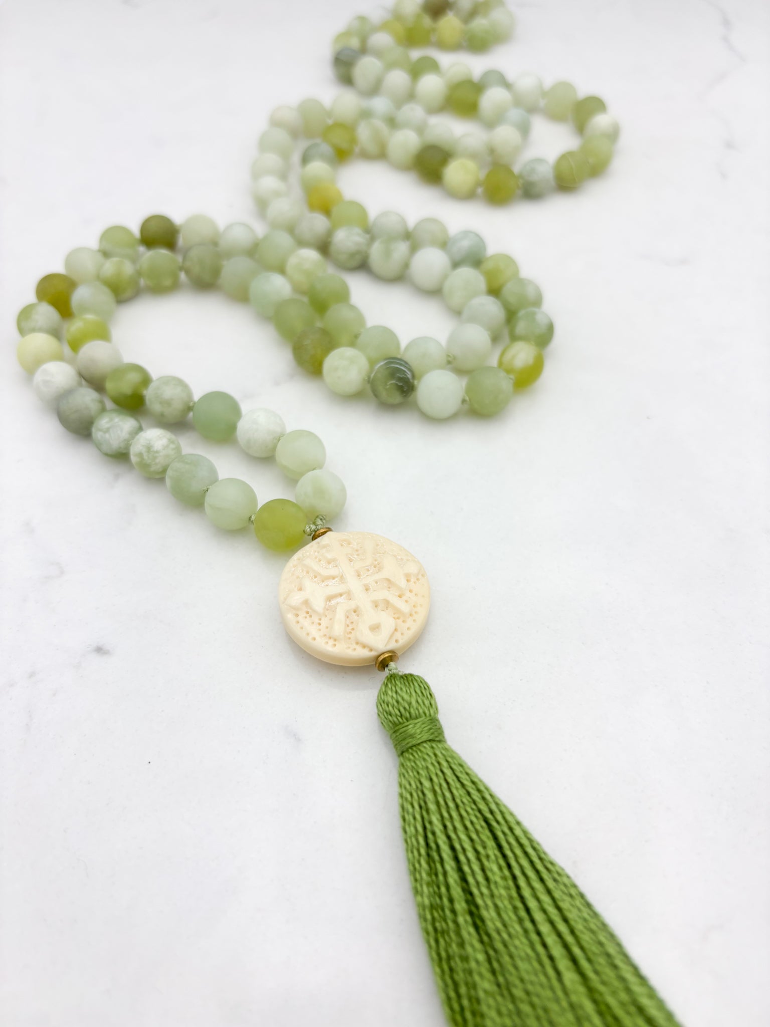 serpentine jade gemstone mala with carved bone guru bead and green tassel | radiant malas | handmade in boulder, colorado