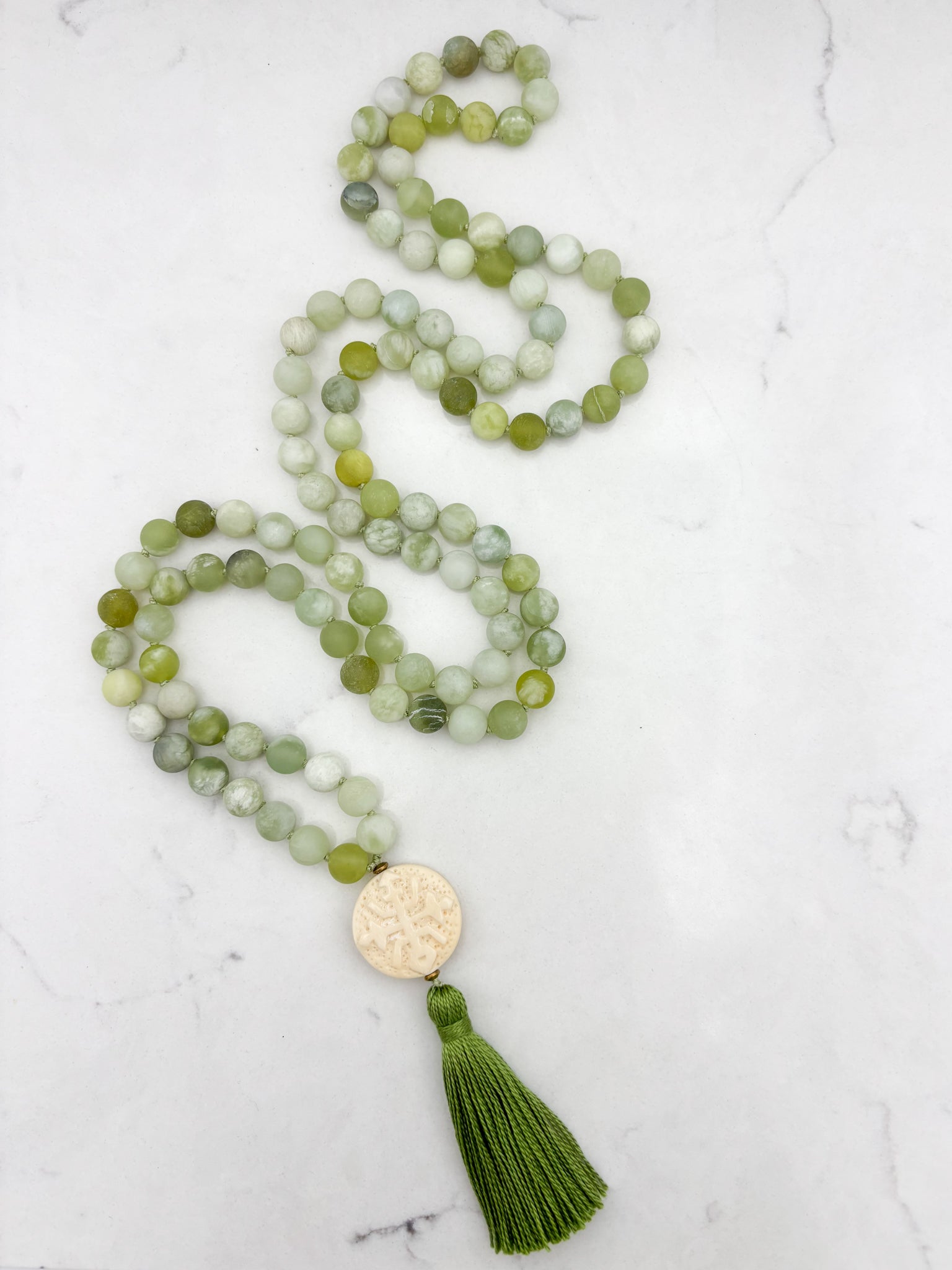 serpentine jade gemstone mala with carved bone guru bead and green tassel | radiant malas | handmade in boulder, colorado