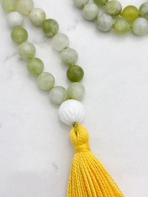serpentine jade gemstone mala with carved white agate guru bead and yellow tassel | radiant malas | handmade in boulder, colorado