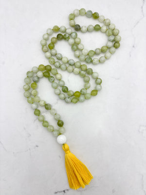serpentine jade gemstone mala with carved white agate guru bead and yellow tassel | radiant malas | handmade in boulder, colorado