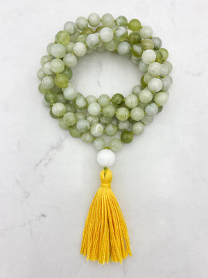 serpentine jade gemstone mala with carved white agate guru bead and yellow tassel | radiant malas | handmade in boulder, colorado