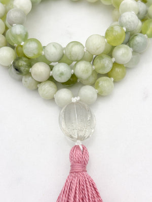 serpentine jade gemstone mala with melon shaped carved glass guru bead and pink tassel | radiant malas  handmade in boulder, colorado