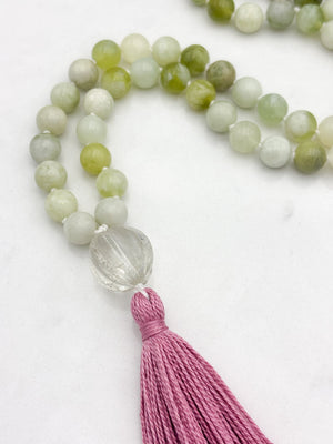 serpentine jade gemstone mala with melon shaped carved glass guru bead and pink tassel | radiant malas  handmade in boulder, colorado